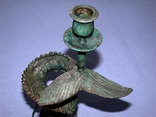 This auction is for an Antique Bronze Verdigris Dolphin Candle Holder.