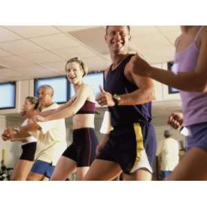  Group of People Exercising in a Step Aerobics Class Giclee 