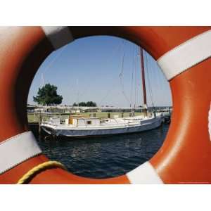 An Orange Life Preserver Frames a Sailboat at the Museum Photographic 
