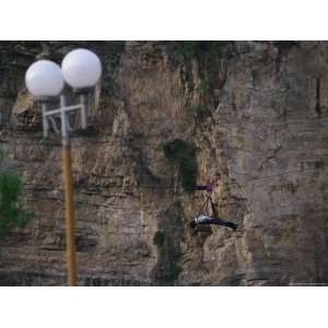  A Man Simulates Flying Using a Harness and Cable at a 