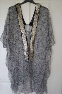 note s details such a gorgeous black and white sheer silk kaftan with