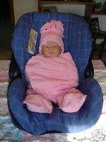 These pictures illustrate how to use your blanket wrap in a car seat.