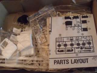   MODEL KIT UNBUILT PARTS SEALED IN BAGS. 1/25 SCALE BOX HAS SOME LIGHT