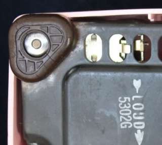 The base of the phone is marked 1952 and the pink plastic shell, dial 