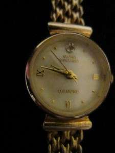   Vanderbilt, Diamond, goldtone, watch with mother of pearl face