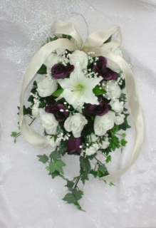   beautiful pew bow is designed in ivory tea roses deep purple roses