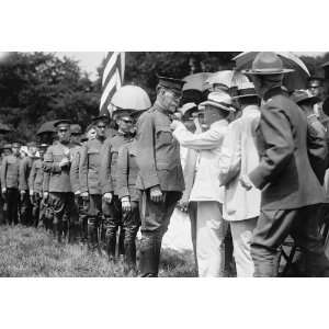   photo HARVEY, WILLIAM E. COLONEL, N. A. BEING DECORATED BY SEC. BAKER